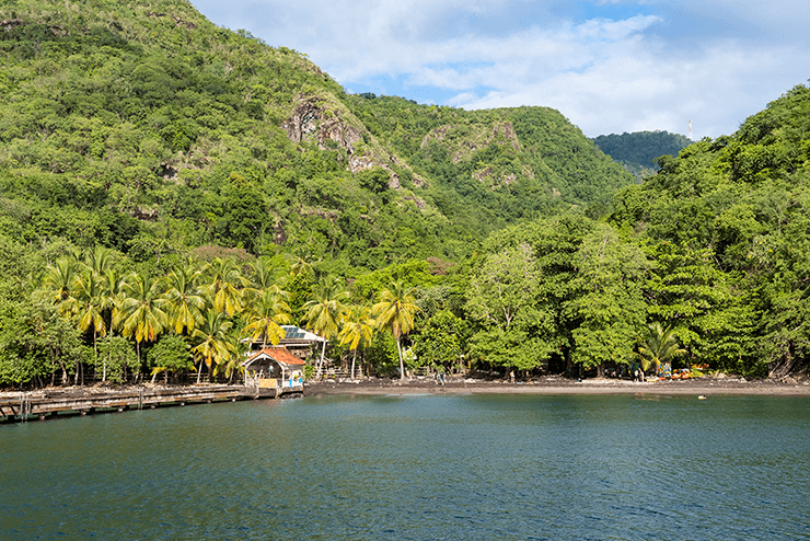 The black sand beach at the cove of Anse Noire.