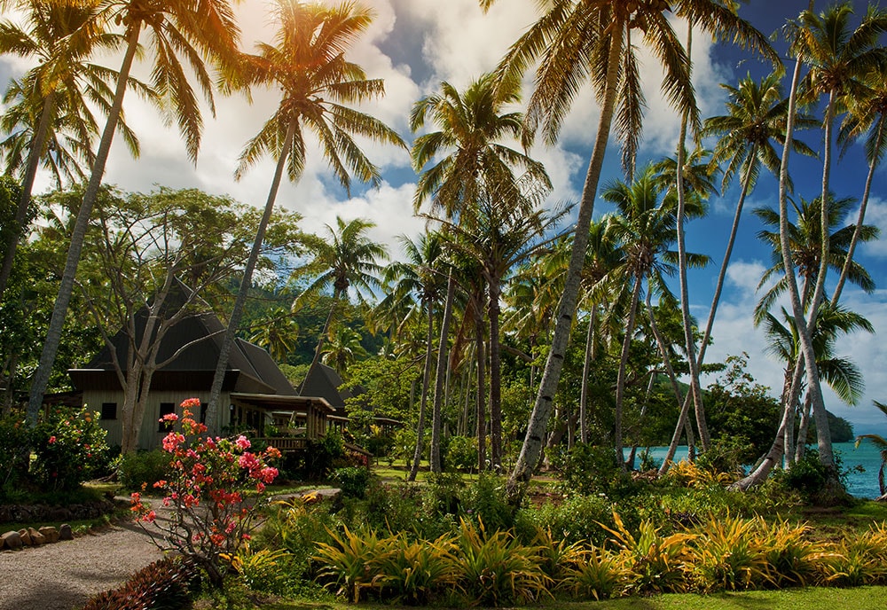 Cottages at Lalati Resort are built in traditional Fijian style, and feature porches with ocean views.