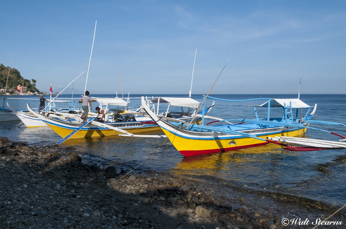 Dive boats are known as Bangkas line the shore at Anilao. With most dive sites just minutes from resorts