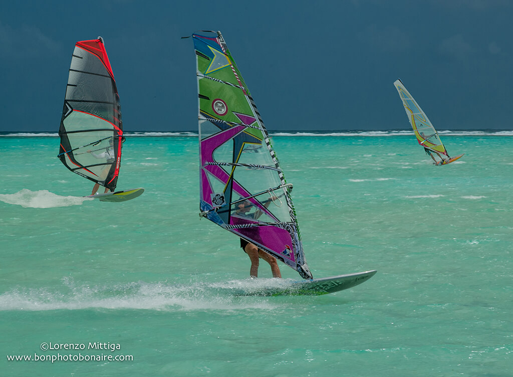 Windsurfers find ideal conditions on Bonaire's east coast, where a large lagoon provides flat water and direct exposure to trade winds. Windsurfers find ideal conditions on Bonaire's east coast, where a large lagoon provides flat water and direct exposure to trade winds.