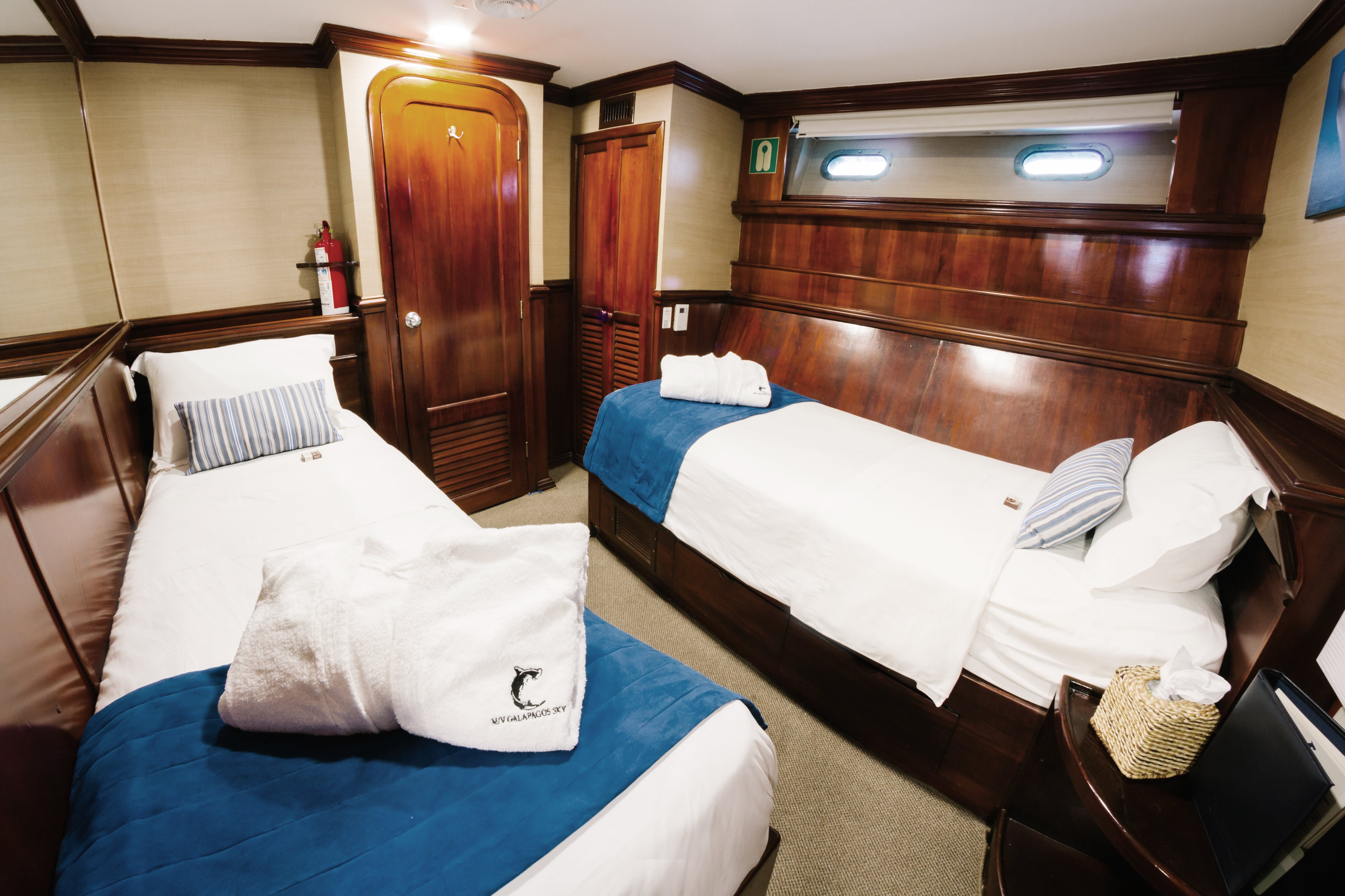Deluxe Cabins are trimmed in rich woodwork and offer twin beds and a private en-suite bathroom. Deluxe Cabins are trimmed in rich woodwork and offer twin beds and a private en-suite bathroom.