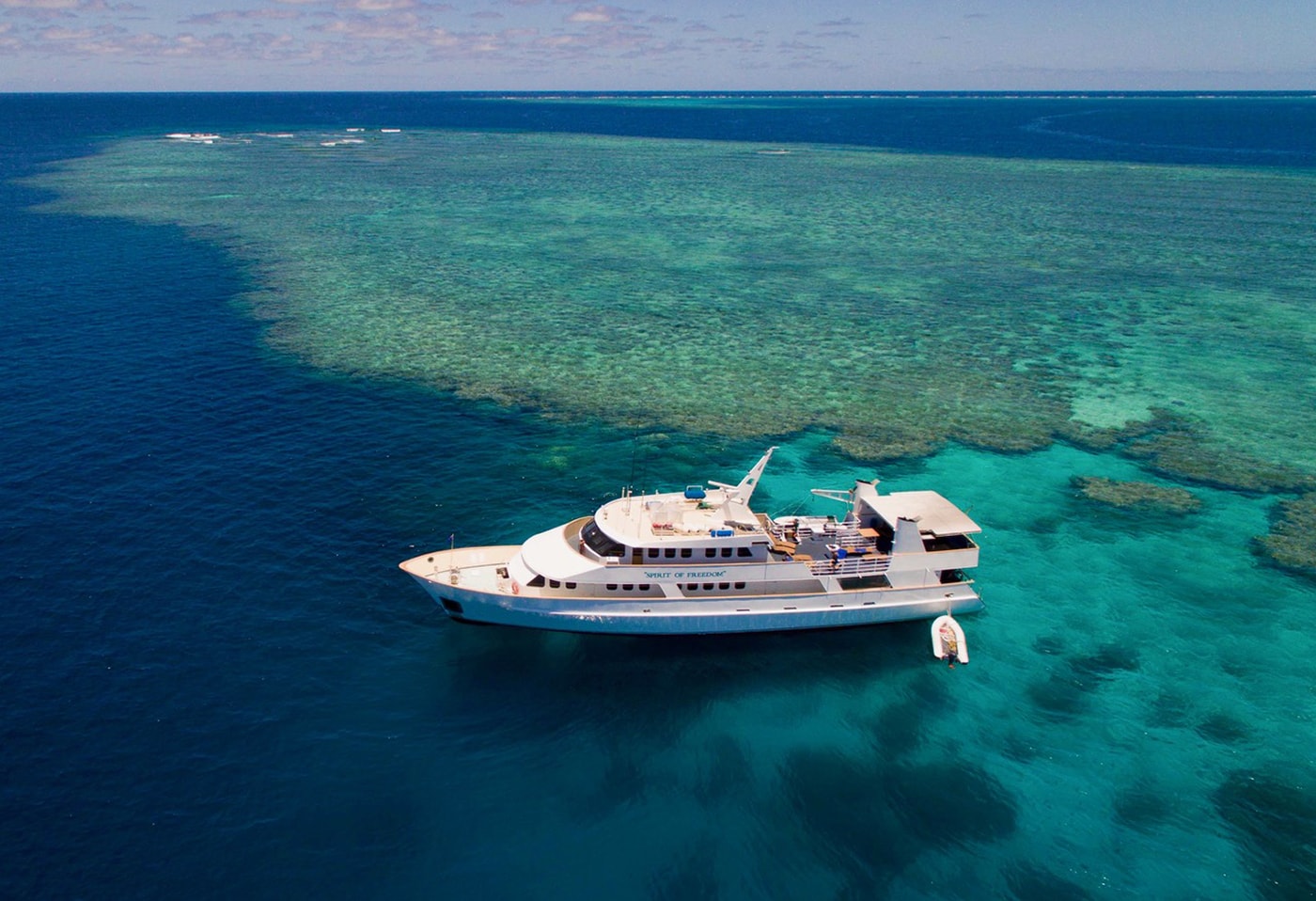 The Spirit of Freedom is often able to moor directly above a dive site, allowing guests to giant stride right from the platform to the reef.