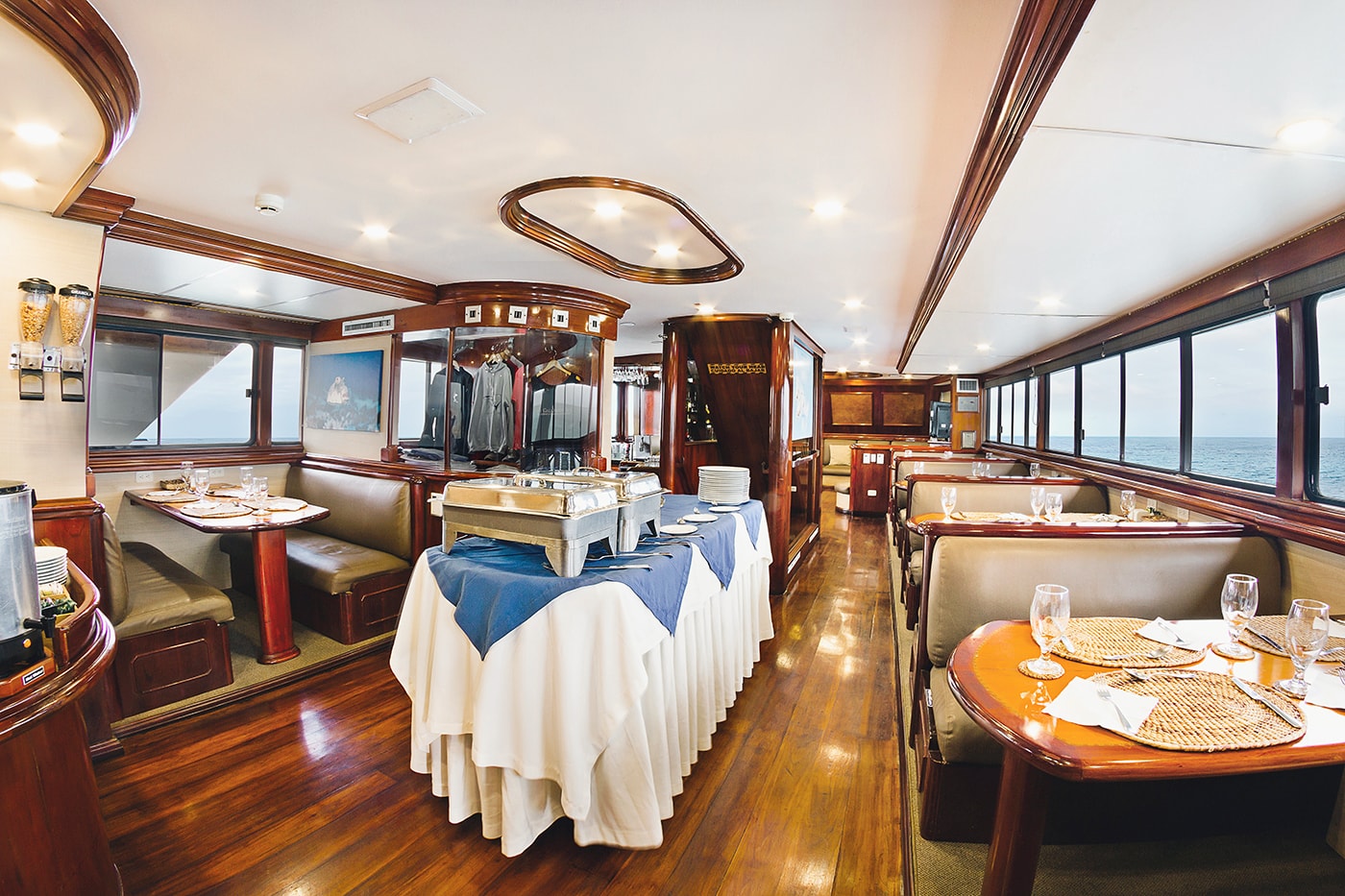 The dining area of the Galapagos Sky has the feel of an upscale restaurant, and also serves up exceptional water views. The dining area of the Galapagos Sky has the feel of an upscale restaurant, and also serves up exceptional water views.
