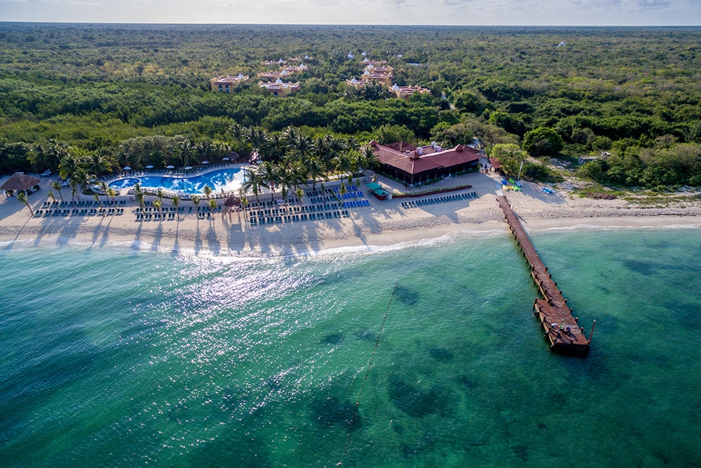 The guest residences at the Occidental Cozumel Resort are set back from the beach within a private nature preserve. The dive center is located next to the pier.