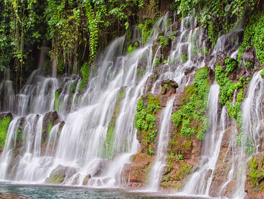 There are many natural treats to see and experience like this cascading waterfall when touring Honduras mainland as part of your scuba diving vacation